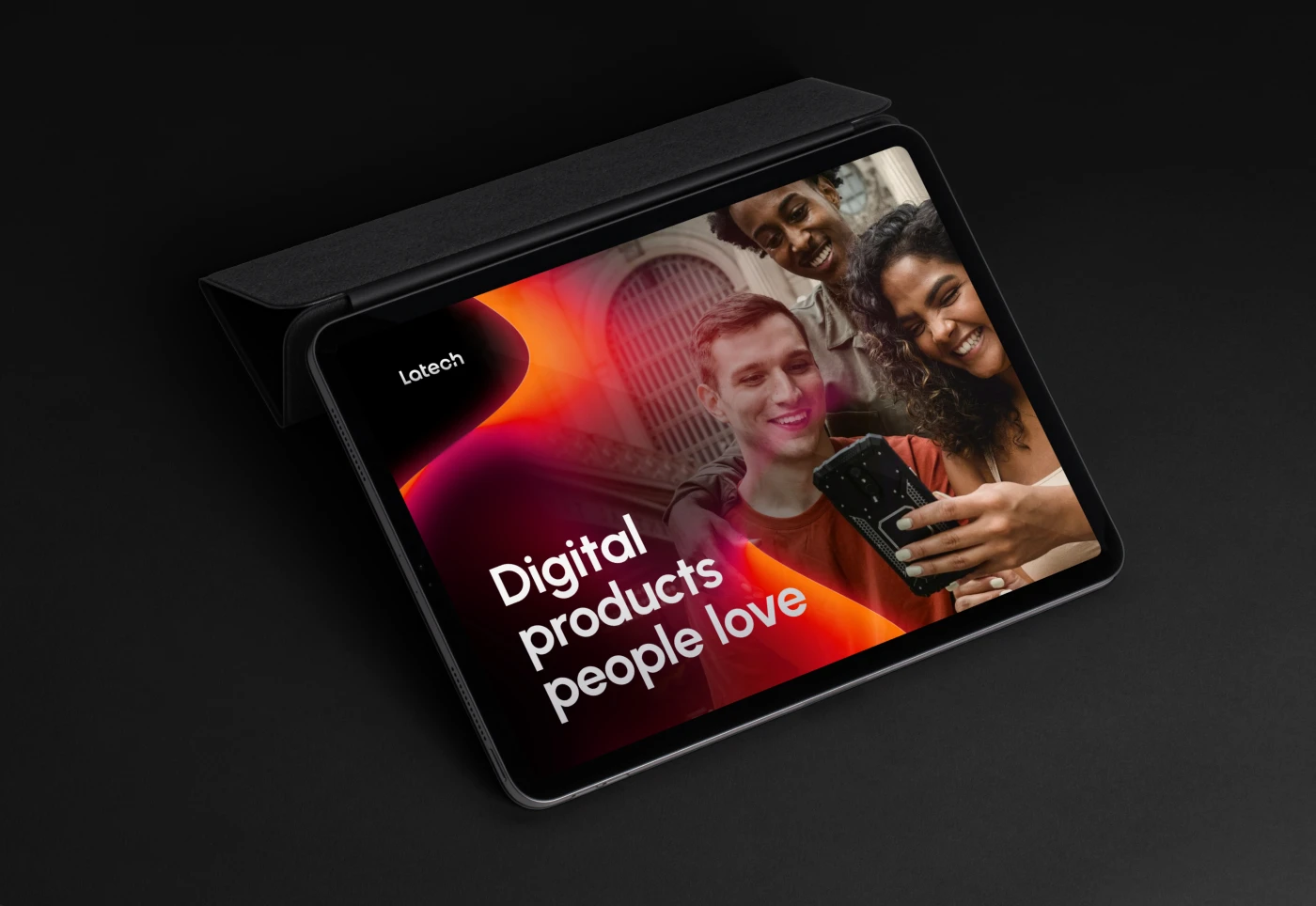 Mockup of an iPad, displaying an ADV for Latech, digital products people love, with an image of happy young people looking in a phone. Part of the Latech (Stravos) project, a Tech startup rebrand by Fabio Besti Interdisciplinary Design for Nemesis Agency